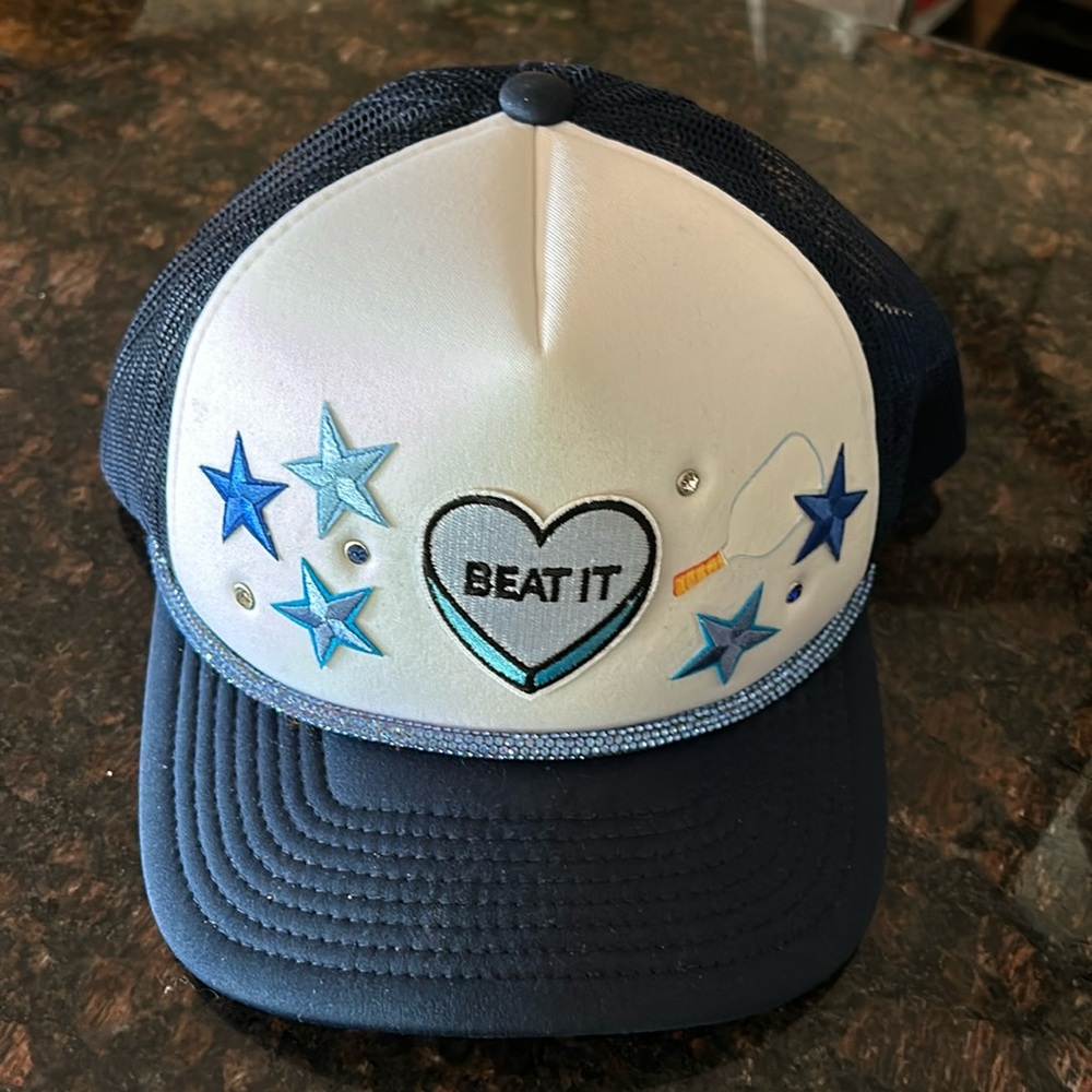NWOT Trucker style baseball cap. Hand decorated bejeweled navy and white hat